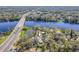 Aerial view of property with a pond and highway nearby at 3820 E Lakeshore Dr, Tampa, FL 33604