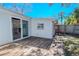 A wooden backyard deck features access to the house and backyard at 3820 E Lakeshore Dr, Tampa, FL 33604