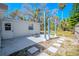 A fenced backyard has a concrete pad and a pull-up bar at 3820 E Lakeshore Dr, Tampa, FL 33604