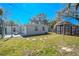 Cozy backyard featuring a shed, stepping stones, and plenty of room to entertain at 3820 E Lakeshore Dr, Tampa, FL 33604