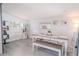 Dining room with seating for four, neutral walls and updated flooring at 3820 E Lakeshore Dr, Tampa, FL 33604