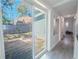 Hallway view through sliding glass door out to the backyard deck at 3820 E Lakeshore Dr, Tampa, FL 33604