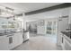 Open concept kitchen with stainless steel appliances and connection to the dining room at 3820 E Lakeshore Dr, Tampa, FL 33604