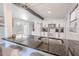 Open kitchen featuring stone countertop, stainless steel sink and a view of the backyard at 3820 E Lakeshore Dr, Tampa, FL 33604