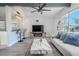 Inviting living room with a fireplace, stylish decor, and a view into an adjacent area, perfect for relaxing at 3820 E Lakeshore Dr, Tampa, FL 33604