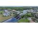 Aerial view of waterfront community with boat lifts, docks, manicured lawns and beautiful waterways at 410 Manns Harbor Dr, Apollo Beach, FL 33572