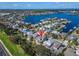 Overhead image showcases real estate nestled along waterways, featuring homes, docks and boats at 410 Manns Harbor Dr, Apollo Beach, FL 33572