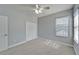 Neutral bedroom features a large closet, windows, and soft carpeted floors at 410 Manns Harbor Dr, Apollo Beach, FL 33572