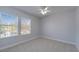 This neutral bedroom features several windows offering lots of natural light at 410 Manns Harbor Dr, Apollo Beach, FL 33572