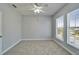 Bedroom featuring neutral colors, carpet, a ceiling fan and natural light from a double window at 410 Manns Harbor Dr, Apollo Beach, FL 33572