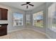Cozy breakfast nook with multiple windows providing natural light and a ceiling fan at 410 Manns Harbor Dr, Apollo Beach, FL 33572