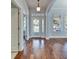 Inviting entryway with hardwood floors, glass front door, and natural light at 410 Manns Harbor Dr, Apollo Beach, FL 33572