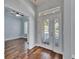 Bright foyer with hardwood floors and a view into the adjacent living spaces at 410 Manns Harbor Dr, Apollo Beach, FL 33572