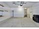Spacious two car garage with white walls and shelving at 410 Manns Harbor Dr, Apollo Beach, FL 33572