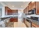 Spacious kitchen with granite countertops, stainless steel appliances, and abundant cabinet space at 410 Manns Harbor Dr, Apollo Beach, FL 33572