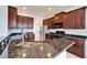 Well-equipped kitchen featuring granite countertops, stainless steel appliances, and ample cabinetry at 410 Manns Harbor Dr, Apollo Beach, FL 33572