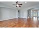 Spacious living room with hardwood floors and neutral paint, offering plenty of space at 410 Manns Harbor Dr, Apollo Beach, FL 33572