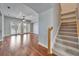 Open living room with hardwood floors and staircase to the upper level at 410 Manns Harbor Dr, Apollo Beach, FL 33572
