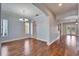 Open living space featuring hardwood floors, modern lighting, and natural light at 410 Manns Harbor Dr, Apollo Beach, FL 33572