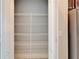 A pantry with wire shelving is shown adjacent to the kitchen, offering lots of storage at 410 Manns Harbor Dr, Apollo Beach, FL 33572