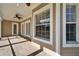 The covered patio features brick flooring, and views of the backyard at 410 Manns Harbor Dr, Apollo Beach, FL 33572