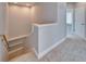 Carpeted staircase with white trim, leading to an upper level of the home at 410 Manns Harbor Dr, Apollo Beach, FL 33572
