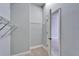 Walk-in closet with carpet and shelving and access to additional storage space at 410 Manns Harbor Dr, Apollo Beach, FL 33572