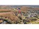 Beautiful aerial view of a home nestled in a lush community with mature trees and landscaping at 5204 Avenue La Crosse, Lutz, FL 33558