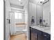 Charming bathroom featuring vanity with marble countertop, and tiled shower-tub at 5204 Avenue La Crosse, Lutz, FL 33558