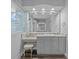 Bathroom vanity with large mirror, makeup area and stool at 5204 Avenue La Crosse, Lutz, FL 33558