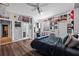 Bright bedroom offers laminate wood floors, a ceiling fan, built-in desk and a view to the ensuite bathroom at 5204 Avenue La Crosse, Lutz, FL 33558