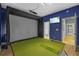 This game room offers a golf simulator with projector and screen, perfect for entertainment at 5204 Avenue La Crosse, Lutz, FL 33558
