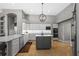 Spacious kitchen with island, modern appliances, and herringbone floors at 5204 Avenue La Crosse, Lutz, FL 33558