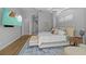Comfortable main bedroom featuring a king bed, plush rug, and luxury furnishings at 5204 Avenue La Crosse, Lutz, FL 33558