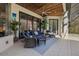 Inviting screened-in outdoor living space with stylish seating and ceiling fan for comfort at 5204 Avenue La Crosse, Lutz, FL 33558