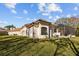 Spacious backyard with well-maintained lawn, patio, screened-in pool and spa at 5204 Avenue La Crosse, Lutz, FL 33558