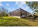 Expansive lawn leads to a screened pool, creating a private backyard retreat at 5204 Avenue La Crosse, Lutz, FL 33558