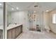 Modern bathroom featuring a glass shower, double vanity, and tile flooring at 547 Suwanee Cir, Tampa, FL 33606