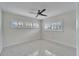 Bedroom with shuttered windows and ceiling fan with access to adjoining rooms at 547 Suwanee Cir, Tampa, FL 33606