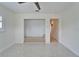 Bedroom with carpeted nook, shuttered windows and ceiling fan with access to adjoining rooms at 547 Suwanee Cir, Tampa, FL 33606