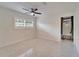Bright room features shuttered windows, ceiling fan, and access to the home's HVAC system at 547 Suwanee Cir, Tampa, FL 33606