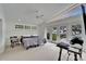 Sunlit bedroom with a ceiling fan, a large window and view of the waterway at 547 Suwanee Cir, Tampa, FL 33606