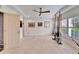 Bonus room with tile floor, ceiling fan, and large windows for lots of natural light at 547 Suwanee Cir, Tampa, FL 33606