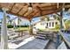 Waterfront backyard features covered dock with ceiling fan and boat lift at 547 Suwanee Cir, Tampa, FL 33606