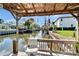 Covered dock offers a peaceful retreat with views of the canal and waterfront homes at 547 Suwanee Cir, Tampa, FL 33606