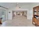 Open-concept living space with light tile flooring, neutral walls, and recessed lighting at 547 Suwanee Cir, Tampa, FL 33606