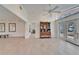 Open-concept living area featuring tiled floors, neutral walls, and natural light at 547 Suwanee Cir, Tampa, FL 33606