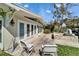 Back patio with tile and outdoor seating next to an attractive water feature at 547 Suwanee Cir, Tampa, FL 33606