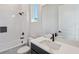 Bathroom with a white tub, shower, toilet, vanity with marble countertops, and black hardware at 5932 Red Mangrove Ln, Bradenton, FL 34210