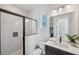 Modern bathroom featuring a glass-enclosed shower, a sleek vanity, and bright lighting at 5932 Red Mangrove Ln, Bradenton, FL 34210